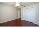 Bedroom with hardwood floors, neutral walls, a closet, and a ceiling fan at 748 Sagewood Dr, Lakeland, FL 33813