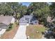 Charming single-story home boasts a well-manicured front lawn, attached garage, and beautiful landscaping at 748 Sagewood Dr, Lakeland, FL 33813