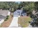 Charming single-story home boasts a well-manicured front lawn, attached garage, and beautiful landscaping at 748 Sagewood Dr, Lakeland, FL 33813
