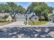 Inviting single-Gathering home with a well-maintained lawn, mailbox, and mature trees in the front yard at 748 Sagewood Dr, Lakeland, FL 33813