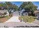 Charming single-story home boasts a well-manicured front lawn, attached garage, and beautiful landscaping at 748 Sagewood Dr, Lakeland, FL 33813