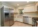 Functional kitchen with stainless steel appliances, white cabinetry, and an eat in area at 748 Sagewood Dr, Lakeland, FL 33813
