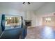 Bright living room boasts a fireplace, high ceilings, and large glass windows with a backyard view at 748 Sagewood Dr, Lakeland, FL 33813