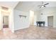 Bright living room showing neutral wall color, tile floors, and access to the other rooms at 748 Sagewood Dr, Lakeland, FL 33813