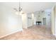 Open-concept living room featuring tile flooring and plenty of space for dining and relaxing at 748 Sagewood Dr, Lakeland, FL 33813