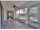 Screened-in porch leading to a backyard with a swing set at 748 Sagewood Dr, Lakeland, FL 33813
