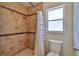 Shower stall featuring neutral tile and a black accent stripe at 748 Sagewood Dr, Lakeland, FL 33813