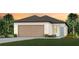 Charming one-story home with a neatly maintained lawn, a two-car garage and an inviting entryway at 9060 Wildlight Trl, Wildwood, FL 34785
