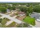 A picturesque aerial view of a neatly arranged residential area with tree-lined streets and landscaped yards at 332 Sand Pine Trl, Winter Haven, FL 33880