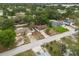 An aerial shot showcasing the property within a lush, green residential neighborhood at 332 Sand Pine Trl, Winter Haven, FL 33880