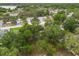 Overhead image displays a well-treed neighborhood showing the property's location among lush greenery at 332 Sand Pine Trl, Winter Haven, FL 33880