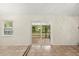 Light-filled room with tile flooring and sliding glass door access to the outdoors at 332 Sand Pine Trl, Winter Haven, FL 33880