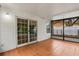 Screened-in porch featuring tile flooring and sliding glass doors that provide ample light at 332 Sand Pine Trl, Winter Haven, FL 33880