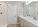 Clean, well-lit bathroom featuring a double vanity and walk-in shower at 4015 Gardenia Ave, Lake Hamilton, FL 33851