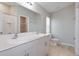 Bathroom featuring double sinks and a shower over tub at 4015 Gardenia Ave, Lake Hamilton, FL 33851
