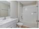 Bathroom featuring single sink vanity, toilet, and shower with a tub at 4015 Gardenia Ave, Lake Hamilton, FL 33851