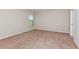 Cozy bedroom with neutral walls, carpet, and a bright window at 4015 Gardenia Ave, Lake Hamilton, FL 33851