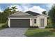 Charming single-story home with a brick driveway and attached two-car garage at 4015 Gardenia Ave, Lake Hamilton, FL 33851