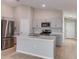 Modern kitchen featuring stainless steel appliances, quartz countertops, and a center island at 4015 Gardenia Ave, Lake Hamilton, FL 33851