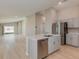 Open-concept kitchen with stainless steel appliances, island, and hardwood floors at 4015 Gardenia Ave, Lake Hamilton, FL 33851