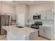 Modern kitchen featuring stainless steel appliances and a quartz countertop island at 4015 Gardenia Ave, Lake Hamilton, FL 33851