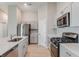 Well-equipped kitchen with stainless steel appliances, quartz countertops, and ample cabinet space at 4015 Gardenia Ave, Lake Hamilton, FL 33851