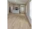 Bright and airy living space with vaulted ceilings, wood floors and access to the kitchen and backyard at 4015 Gardenia Ave, Lake Hamilton, FL 33851