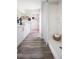 Bright bathroom with white tiled shower, wood look floors, and modern vanity at 4027 Gardenia Ave, Lake Hamilton, FL 33851