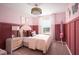 Charming bedroom with pink accents, soft lighting, and a comfortable bed at 4027 Gardenia Ave, Lake Hamilton, FL 33851