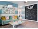 Bright and colorful living room with comfortable seating, playful decor, and a chalkboard wall at 4027 Gardenia Ave, Lake Hamilton, FL 33851