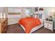 Bright bedroom featuring modern décor, a bed with colorful pillows, and a window that lets in natural light at 4039 Gardenia Ave, Lake Hamilton, FL 33851