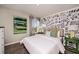 Bright bedroom with large windows, math-themed wall art, stylish furnishings, and colorful decor for a modern look at 4039 Gardenia Ave, Lake Hamilton, FL 33851