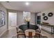 Dining room with a round table and chairs, modern decor, and plenty of natural light at 4039 Gardenia Ave, Lake Hamilton, FL 33851