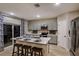 Stylish kitchen features an island with seating, modern appliances, ample cabinet space, and bright lighting at 4039 Gardenia Ave, Lake Hamilton, FL 33851