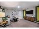 Cozy living room with accent wall, comfortable seating, entertainment center, and decorative elements at 4039 Gardenia Ave, Lake Hamilton, FL 33851