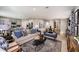 Open-concept living area with modern furnishings, stylish decor, and hardwood floors at 4039 Gardenia Ave, Lake Hamilton, FL 33851