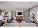 Cozy living room featuring stylish furniture, contemporary decor, and plenty of natural light at 4039 Gardenia Ave, Lake Hamilton, FL 33851