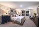 Serene main bedroom featuring a comfortable bed, elegant decor, soft lighting, and stylish furnishings at 4039 Gardenia Ave, Lake Hamilton, FL 33851
