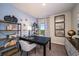 Comfortable home office featuring built-in shelving, desk, and natural light at 4039 Gardenia Ave, Lake Hamilton, FL 33851