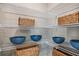 Pantry features wire shelving with baskets and bowls for organized storage of kitchen essentials at 4039 Gardenia Ave, Lake Hamilton, FL 33851