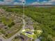 Stunning aerial shot emphasizing the property's location within a community surrounded by scenic ponds and lush greenery at 421 Sierra Mike Blvd, Lake Alfred, FL 33850