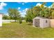 Backyard featuring a storage shed at 421 Sierra Mike Blvd, Lake Alfred, FL 33850