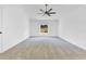 Spacious bedroom with carpet floors, a ceiling fan, and plenty of natural light at 421 Sierra Mike Blvd, Lake Alfred, FL 33850