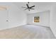 Bright bedroom with vaulted ceiling, carpet floors, and a large window at 421 Sierra Mike Blvd, Lake Alfred, FL 33850