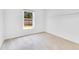 Bedroom with neutral carpet, bright window, and modern features at 421 Sierra Mike Blvd, Lake Alfred, FL 33850