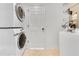Laundry area with washer and dryer hookups, offering convenience and functionality at 421 Sierra Mike Blvd, Lake Alfred, FL 33850