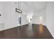 Spacious living room featuring hardwood floors, archways, and modern lighting fixtures at 421 Sierra Mike Blvd, Lake Alfred, FL 33850