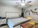 Comfortable bedroom featuring a ceiling fan, decorative shelves, and ample natural light at 4730 Se 141St Pl, Summerfield, FL 34491