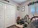 Walk-in closet featuring built-in storage, plush seating, and natural light from a window at 4730 Se 141St Pl, Summerfield, FL 34491