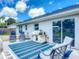 Patio with pavers, outdoor seating, and sliding glass doors to the backyard at 4730 Se 141St Pl, Summerfield, FL 34491